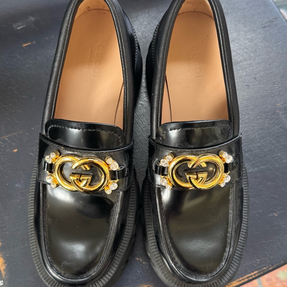 Gucci Glossy Black Loafers with Gold Emblem